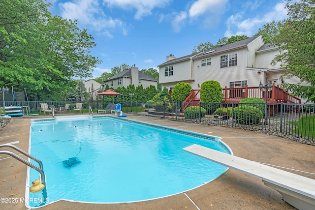 352 Meadowood Rd, Jackson, NJ 08527 - view of pool featuring fence, a diving board, and a trampoline
