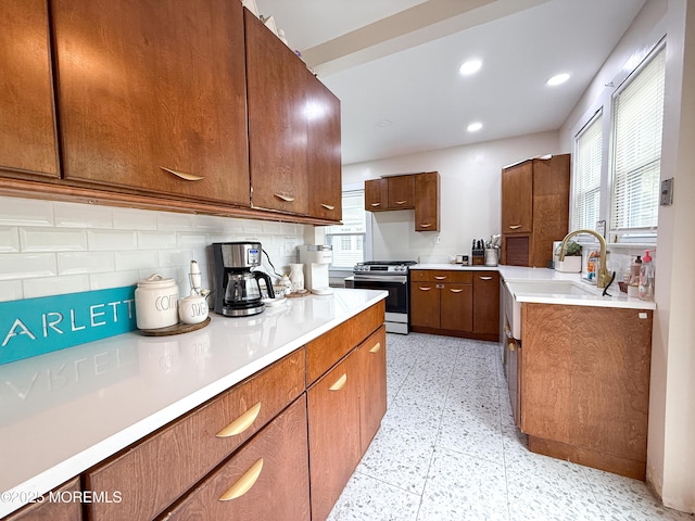 7 Dock St, Toms River, NJ 08753 - kitchen with gas range, a sink, tasteful backsplash, light countertops, and recessed lighting