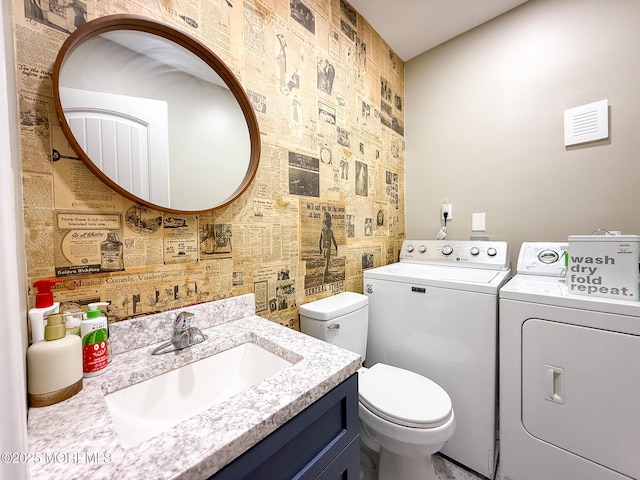 7 Dock St, Toms River, NJ 08753 - half bath with washer and clothes dryer, an accent wall, toilet, and vanity