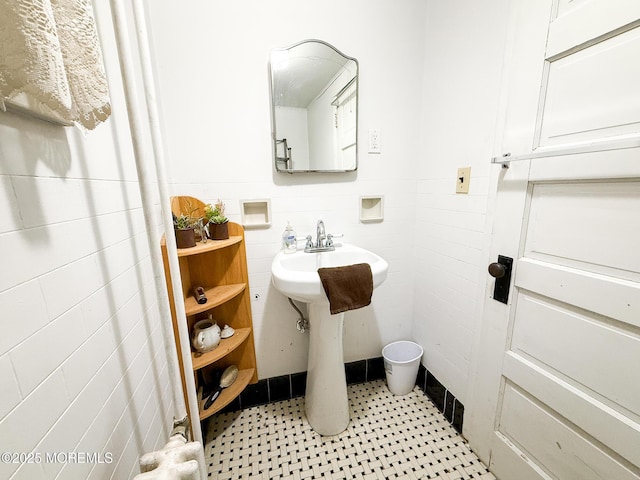 7 Dock St, Toms River, NJ 08753 - bathroom featuring a sink, wainscoting, and tile walls