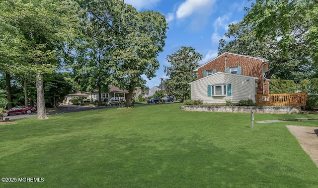 221 Harrison Ave, Oakhurst, NJ 07755 - view of green lawn with a wooden deck