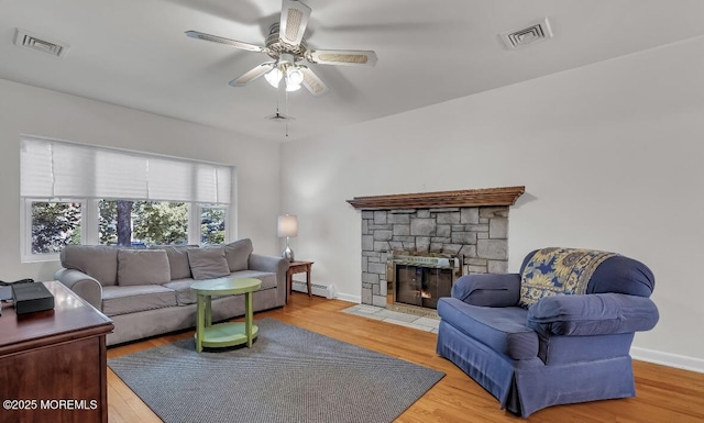 221 Harrison Ave, Oakhurst, NJ 07755 - living area with a ceiling fan, a baseboard heating unit, and wood finished floors