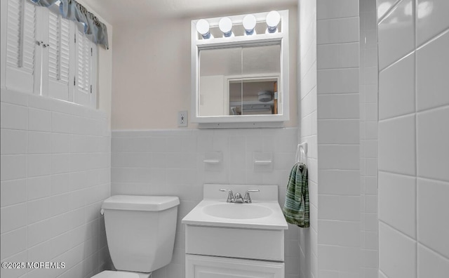 221 Harrison Ave, Oakhurst, NJ 07755 - bathroom with toilet, tile walls, and vanity