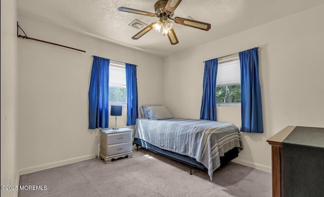 221 Harrison Ave, Oakhurst, NJ 07755 - carpeted bedroom with multiple windows, baseboards, a ceiling fan, and a textured ceiling