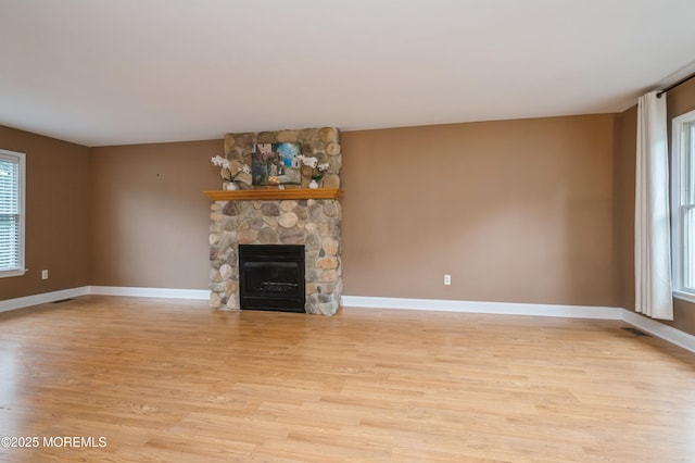 476 Birch Bark Dr, Brick, NJ 08723 - unfurnished living room featuring light wood-style floors, plenty of natural light, and a fireplace