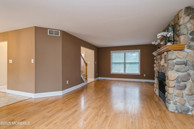 476 Birch Bark Dr, Brick, NJ 08723 - unfurnished living room with a fireplace, light wood-style floors, stairway, and baseboards