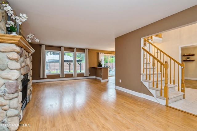 476 Birch Bark Dr, Brick, NJ 08723 - unfurnished living room with a fireplace, wood finished floors, stairway, and baseboards