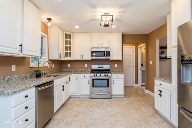 476 Birch Bark Dr, Brick, NJ 08723 - kitchen with stainless steel appliances, a sink, recessed lighting, white cabinets, and glass insert cabinets