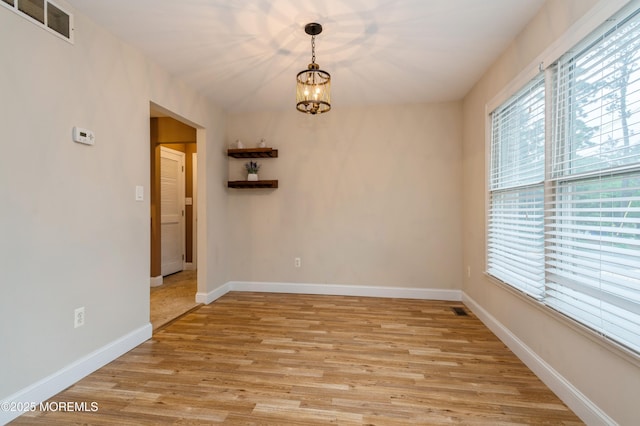 476 Birch Bark Dr, Brick, NJ 08723 - unfurnished room with light wood-type flooring, a chandelier, and baseboards