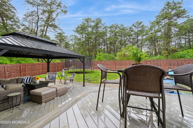 476 Birch Bark Dr, Brick, NJ 08723 - wooden terrace featuring a trampoline, a gazebo, outdoor dining area, and an outdoor living space