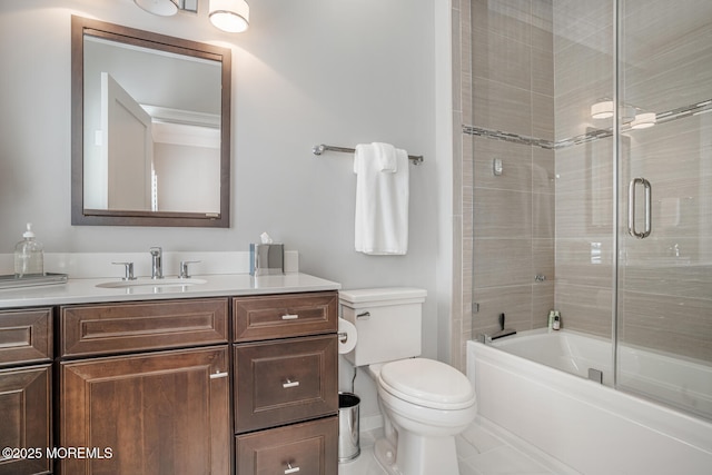 full bath with vanity, toilet, and enclosed tub / shower combo