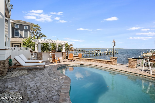outdoor pool featuring a water view, a patio area, a boat dock, boat lift, and a pergola