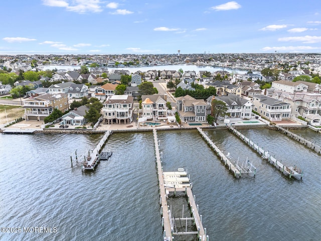 aerial perspective of suburban area featuring a nearby body of water