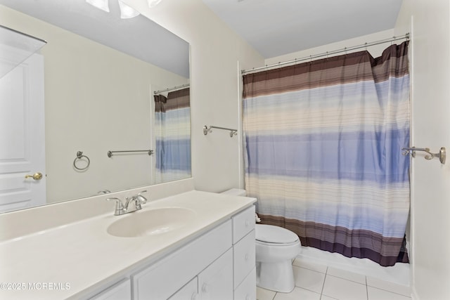 bathroom with tile patterned flooring, toilet, vanity, and a shower with curtain