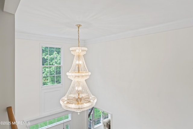 detailed view of ornamental molding and a chandelier