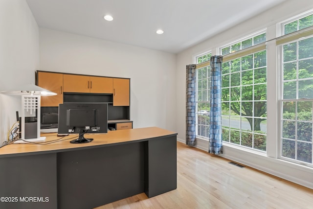 office featuring light wood-style floors, recessed lighting, and baseboards
