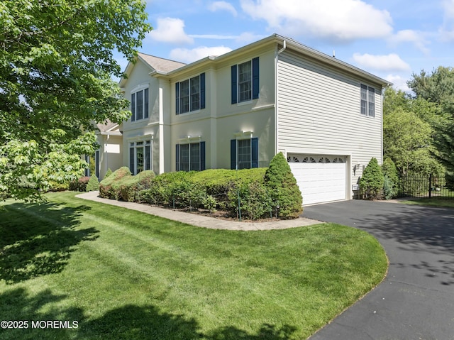 view of home's exterior featuring an attached garage and driveway