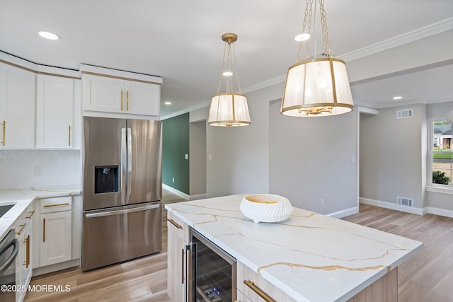 983 Cedar Grove Rd, Toms River, NJ 08753 - kitchen featuring stainless steel fridge with ice dispenser, wine cooler, light wood-style floors, crown molding, and light stone countertops