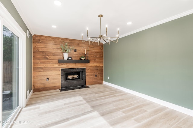 983 Cedar Grove Rd, Toms River, NJ 08753 - unfurnished living room featuring baseboards, a fireplace with flush hearth, recessed lighting, crown molding, and wooden walls