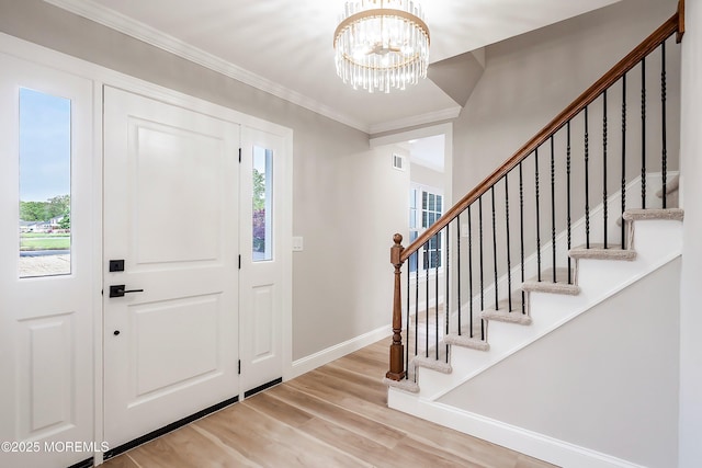 983 Cedar Grove Rd, Toms River, NJ 08753 - entryway featuring stairs, wood finished floors, a chandelier, ornamental molding, and baseboards