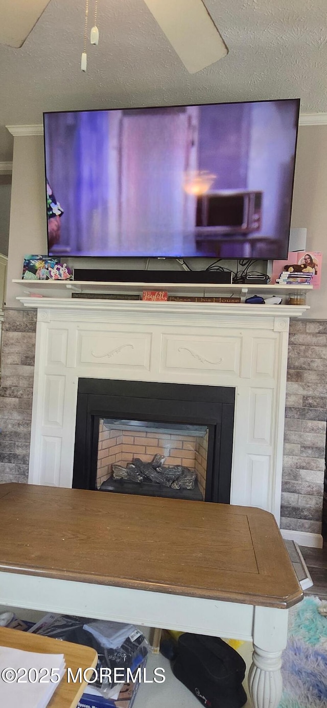 detailed view of a fireplace and crown molding