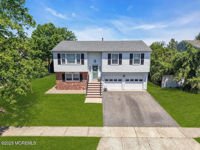 22 Orchard Ct, Howell, NJ 07731 - split foyer home featuring driveway, a garage, and brick siding