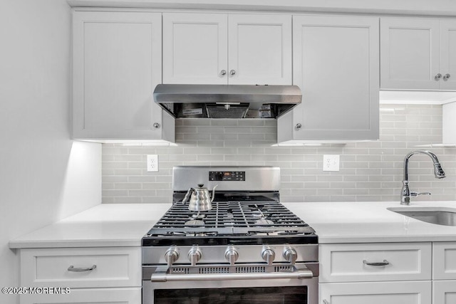 22 Orchard Ct, Howell, NJ 07731 - kitchen with gas range, range hood, a sink, white cabinets, and light countertops
