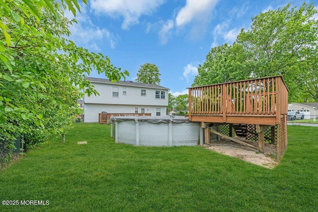 22 Orchard Ct, Howell, NJ 07731 - back of property featuring a deck, a covered pool, and a lawn