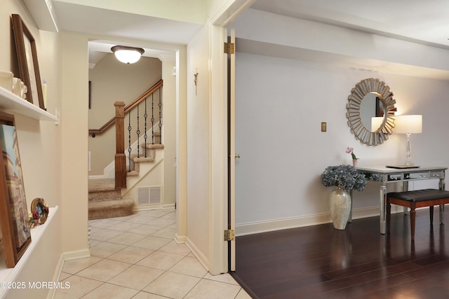 39 Snowdrift Ln, Howell, NJ 07731 - corridor featuring stairs, baseboards, and light tile patterned floors