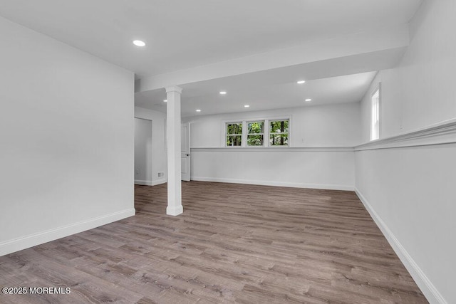 below grade area with recessed lighting, baseboards, and wood finished floors