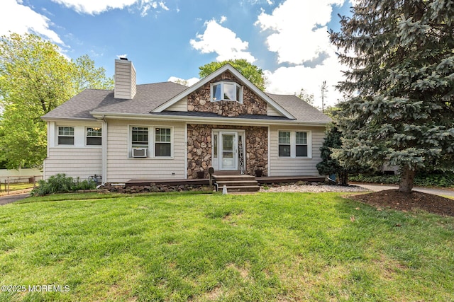 rear view of property featuring a chimney, roof with shingles, a lawn, and stone siding