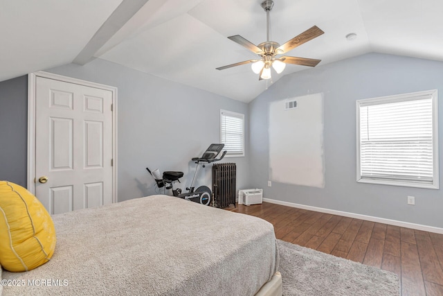 bedroom featuring vaulted ceiling, hardwood / wood-style flooring, baseboards, and a ceiling fan