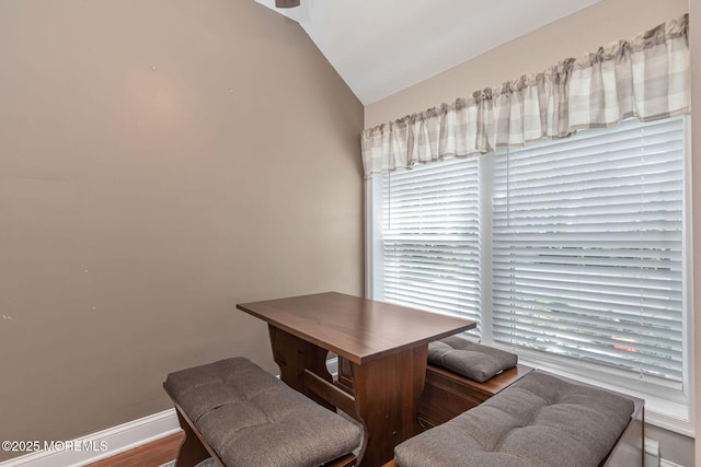 home office with lofted ceiling and baseboards