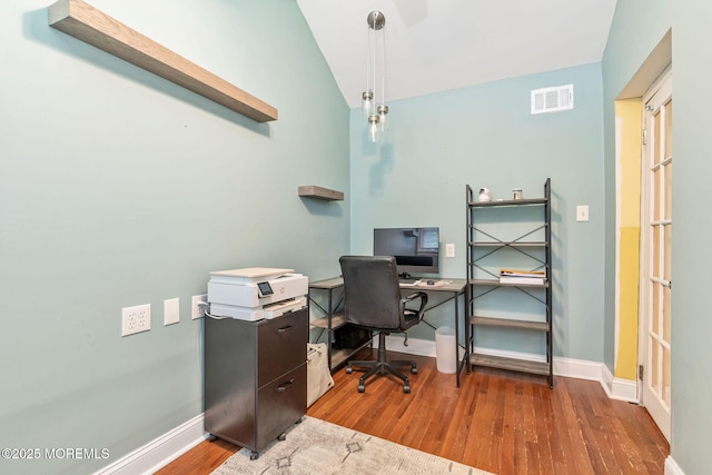 office with wood finished floors, baseboards, and lofted ceiling