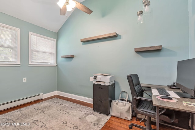office area with a baseboard radiator, a ceiling fan, wood finished floors, lofted ceiling, and baseboards