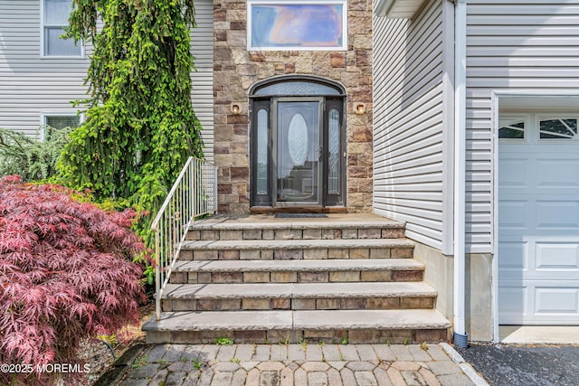 property entrance with stone siding