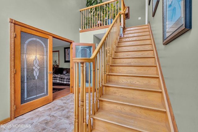 staircase featuring tile patterned floors