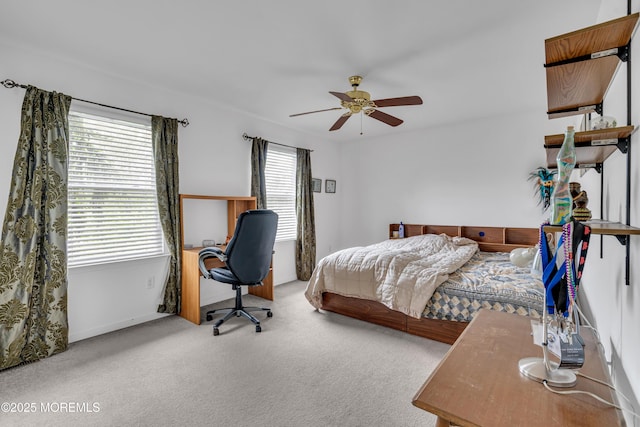 bedroom featuring carpet floors, a desk, and ceiling fan