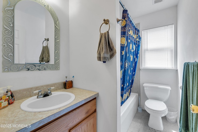 bathroom featuring toilet, vanity, tile patterned flooring, and shower / tub combo with curtain
