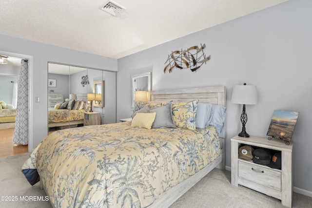 bedroom featuring a closet and carpet floors