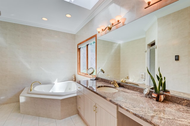 full bath with tile patterned floors, a skylight, a tub with jets, crown molding, and vanity