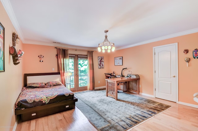 bedroom featuring access to outside, wood finished floors, ornamental molding, baseboards, and a chandelier