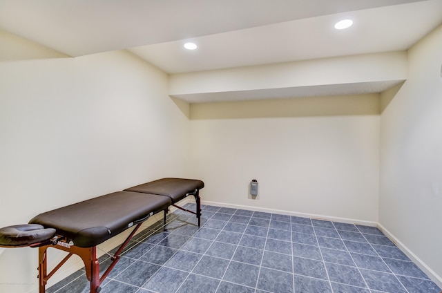 living area featuring baseboards and recessed lighting