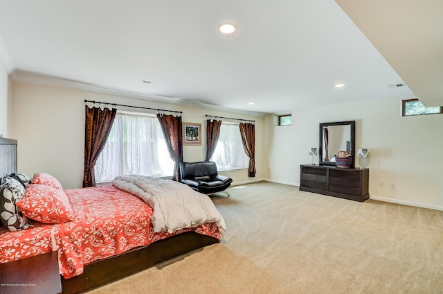 carpeted bedroom with multiple windows, baseboards, ornamental molding, and recessed lighting