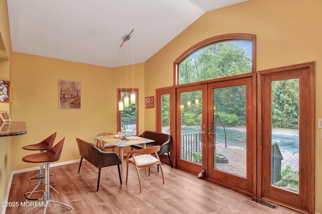 7 Mccampbell Rd, Holmdel, NJ 07733 - dining area with french doors, lofted ceiling, and wood finished floors