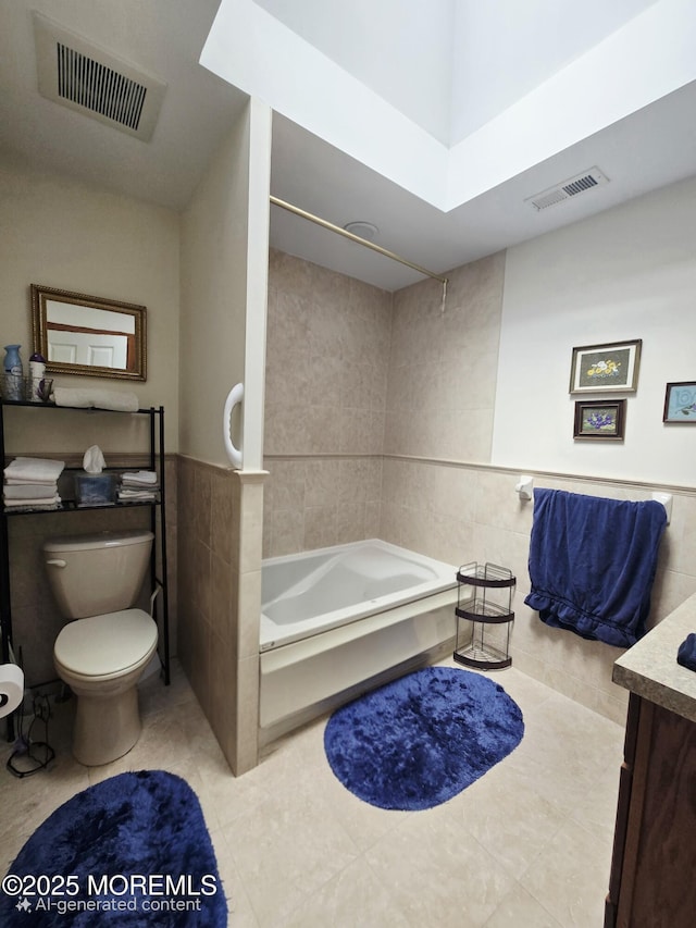 804 Brookside Dr, Toms River, NJ 08753 - full bath featuring tile walls, toilet, tile patterned floors, vanity, and  shower combination