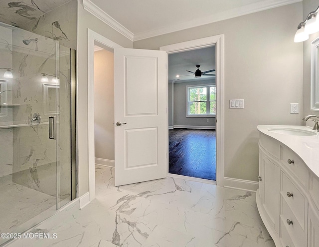bathroom featuring marble look tile flooring, a marble finish shower, baseboards, crown molding, and vanity