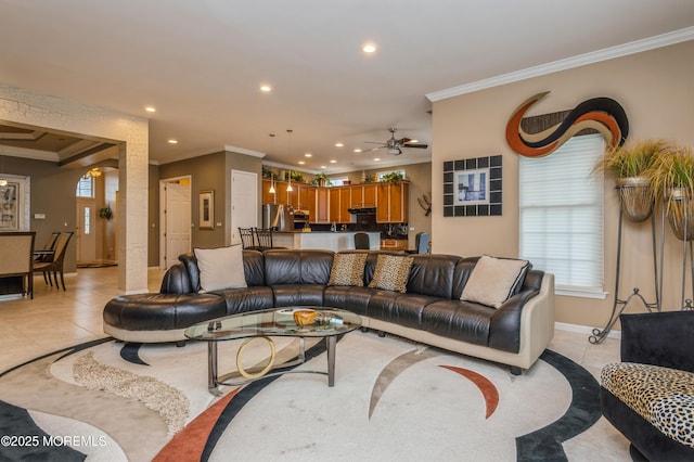 living room with ornamental molding, recessed lighting, baseboards, light tile patterned flooring, and ceiling fan