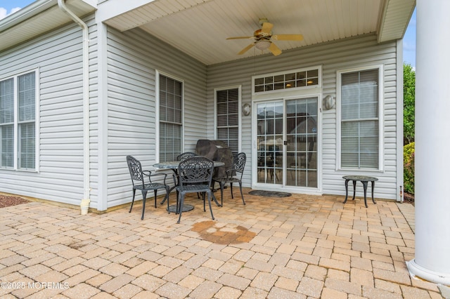 view of patio featuring a ceiling fan and outdoor dining space