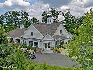 rear view of property with french doors
